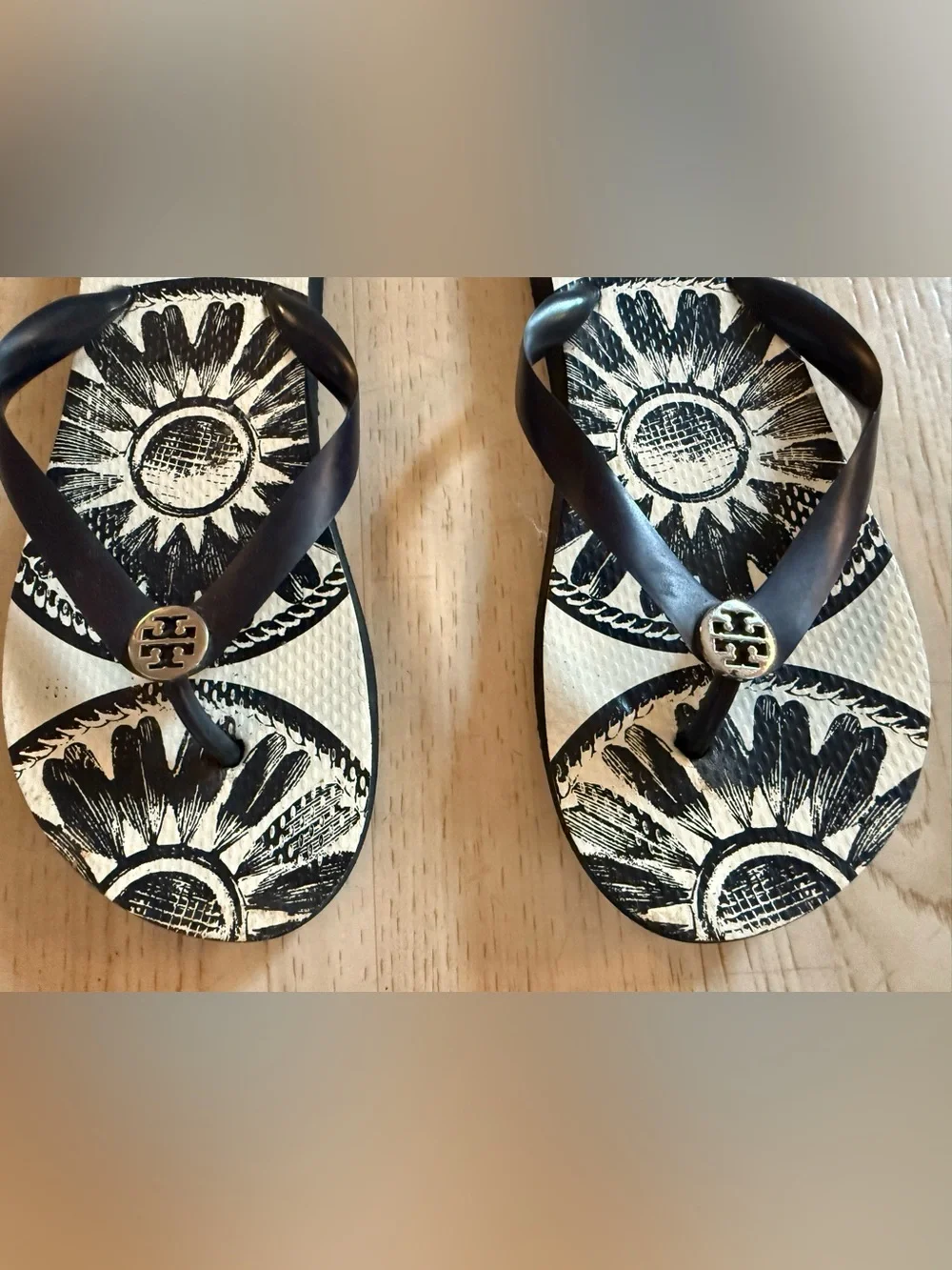 Tory Burch Black & White Sunburst Flip Flops with Logo Accent